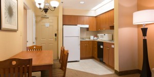 Gallery Kitchen with Living Room - staySky Suites I-Drive Orlando