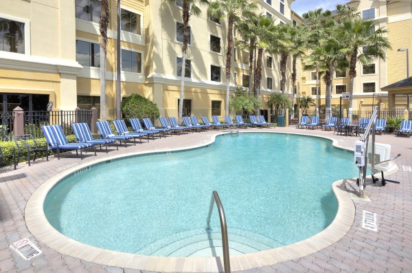 Poolside relaxation at staySky Suites I-Drive Orlando